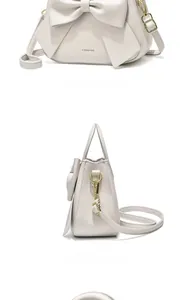Vues détaillées du sac à main blanc crème avec grand nœud en cuir et détails dorés