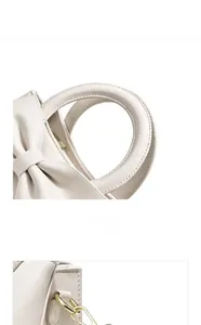 Détails du sac à main en cuir blanc avec décoration de nœud et finitions en métal doré