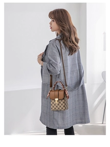 Detail of checkered mini crossbody bag with silk scarf handle and gold buckle
