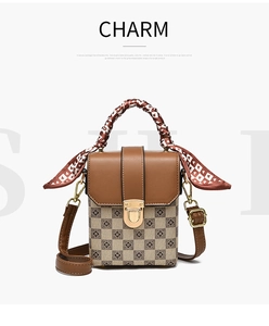Detail view of mini crossbody bag with checkerboard pattern and scarf wrapped handle