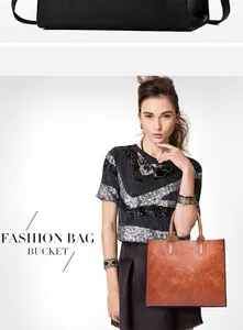 Detalle del bolso tote de cuero sintético marrón con asa negra y textura de alta calidad