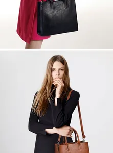 Detalle de bolso tote vintage con relieves florales en negro y marrón con correa ajustable