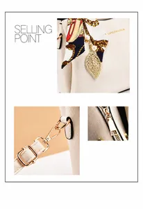 Dettaglio borsa crema in pelle martellata con ciondolo a foglia e accessorio foulard