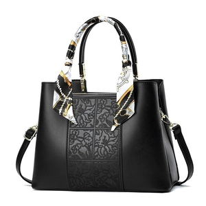 Elegant black embroidered leather handbag for women with silk scarf and gold hardware