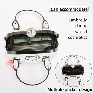 Detailed interior of a white shell bag showing multiple compartments and high capacity
