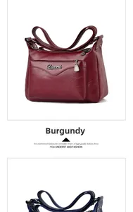 Detailed view of wine red crossbody bag featuring litchi grain leather and metal logo