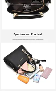 Détail du sac à main en cuir grainé noir avec fermetures dorées et intérieur spacieux