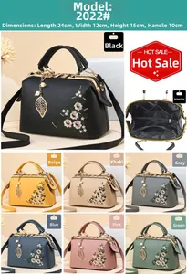 Detailed views of floral embroidery Boston bag with compartments and size dimensions