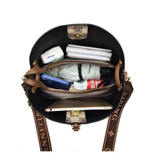 Vertical view showing high capacity interior of this vintage checkerboard bucket bag