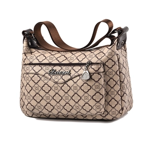 Vintage Umhängetasche in Beige mit Kleeblatt-Print und braunem Stoffgurtband