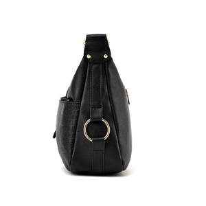 Black soft leather tote bag with side crocodile texture and gold ring hardware detail