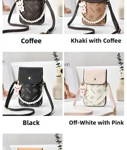 Detail of crossbody phone bags in four colors with pearl handles and bear charms