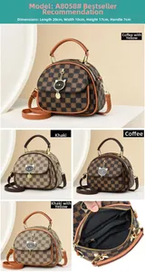 Detail view of mini checkered handbag with cat charm and 20x10x17cm dimensions
