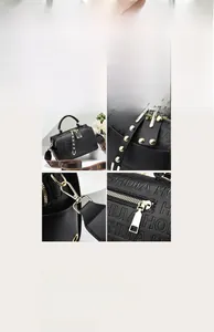 Detail of black Boston handbag with embossed texture and wide logo webbing strap