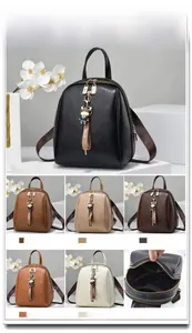 Detailed view of women's soft leather backpack showing dual zippers and multi-color options