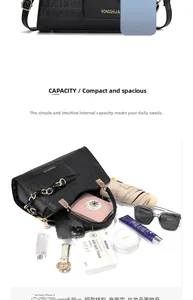 Détail de la capacité intérieure du sac à main noir pour téléphone et cosmétiques