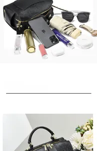 Spacious interior of embossed letter pillow bag showing storage for phone and cosmetics