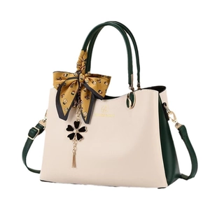 Elegant color-block top handle bag in beige and dark green with floral scarf accessory