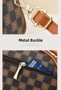 Detail view of golden hardware clasp and adjustable brown leather strap on luxury handbag
