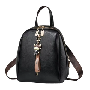 Women's black soft leather backpack with bull pendant and golden zipper details