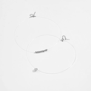 S925 sterling silver invisible fish line necklace featuring zircon and silver beads detail