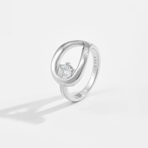 Detailed macro view of S925 sterling silver ring with hollow teardrop setting and zircon