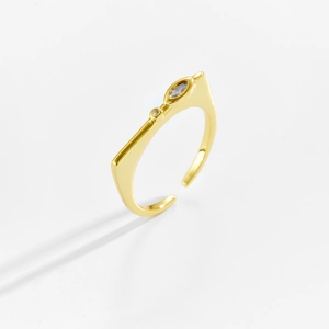 Macro detail of adjustable gold ring featuring asymmetrical marquise and round zircon stones