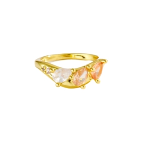 Chic 18K gold ring featuring three pear-cut gemstones in clear and peach tones