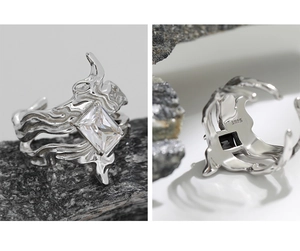 Macro detail of S925 sterling silver ring featuring irregular lava texture and zircon stone