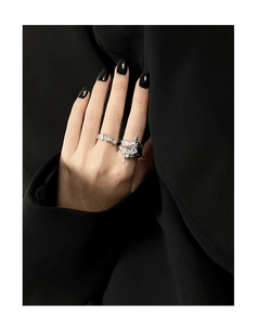 Detailed view of silver irregular texture rings with marquise zircon on a model