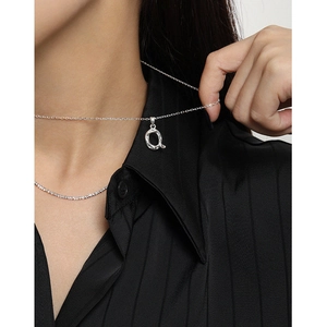 Minimalist S925 sterling silver necklace with an irregular textured letter Q pendant
