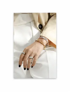 Minimalist liquid metal bracelets and silver rings on model in gold and silver finish