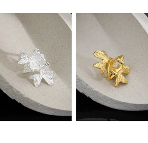 Close-up of S925 sterling silver butterfly ear clips with textured hammered finish