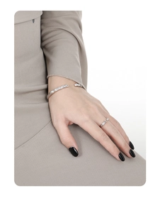 Detail view of S925 sterling silver cuff bracelet and ring set with square zirconias