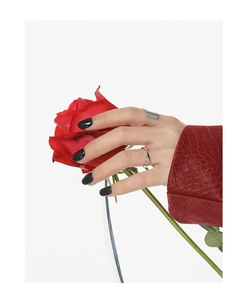 Close-up of minimalist S925 silver open rings on a hand with red rose aesthetic