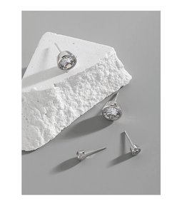 Close-up of S925 sterling silver stud earrings with round cubic zirconia in two sizes