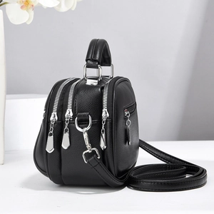 Classic black leather multi-zipper crossbody handbag with top handle and silver hardware