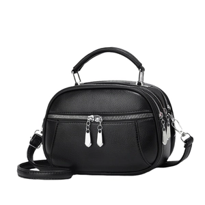 Classic black litchi pattern mini round handbag with adjustable strap and silver zippers