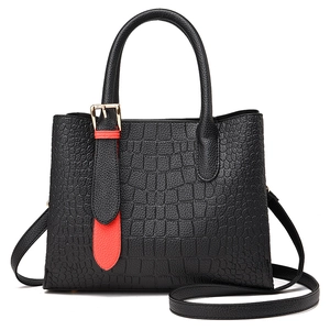 Classic black crocodile texture tote bag with red strap and golden metal buckle details