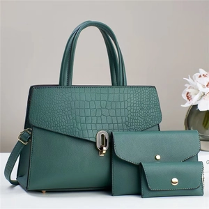 Three-piece dark green handbag set with crocodile pattern and golden metal hardware details