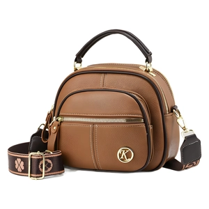 Brown litchi texture crossbody bag with gold K logo and patterned jacquard strap