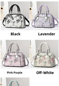 Detail der floralen Jacquard-Boston-Tasche mit Doppelreißverschluss und Silbergriffen