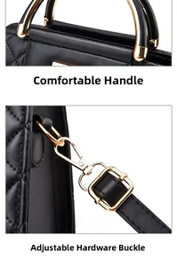 Detail of golden metal handles and adjustable strap hooks on black quilted handbag