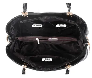 Détail de l'intérieur du sac à main avec compartiment zippé et multiples poches pratiques