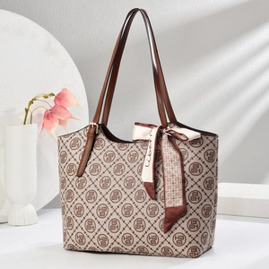 Classic checkered tote bag with leather handles and decorative silk scarf accessory