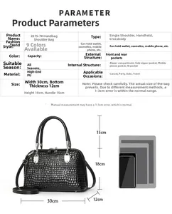Detailed view of black snakeskin tote bag dimensions with internal zipper compartment