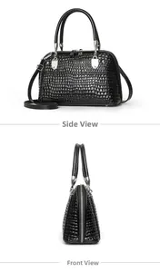 Detail view of glossy black faux snake skin shell bag showing side and canted angles