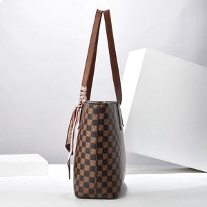 Classic brown checkerboard tote bag with leather handles and decorative silk scarf