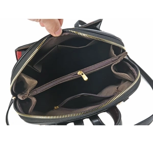 Large capacity striped backpack with multi-layer interior storage and textured leather