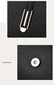 Detail of magnetic hardware buckle on black textured leather crossbody bag